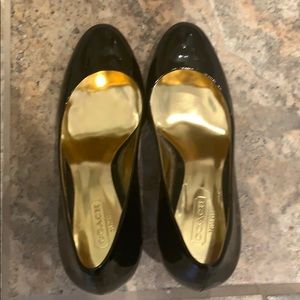 Coach black patent pumps